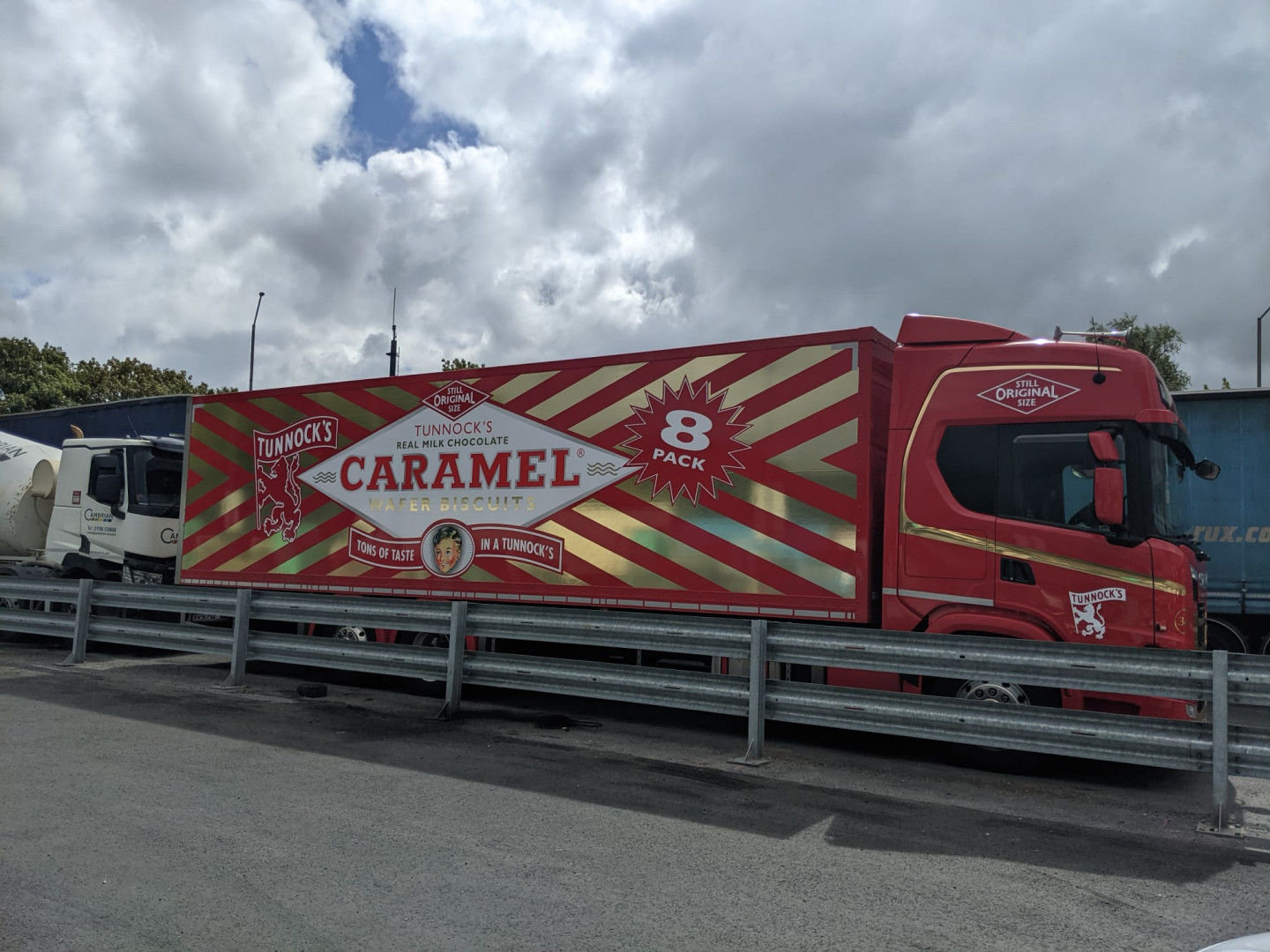 A Tunnocks caramel wafer themed lorry parked at a motorway service station